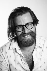 Black-and-white portrait of Peter Murphy Lewis, founder of Strategic Pete