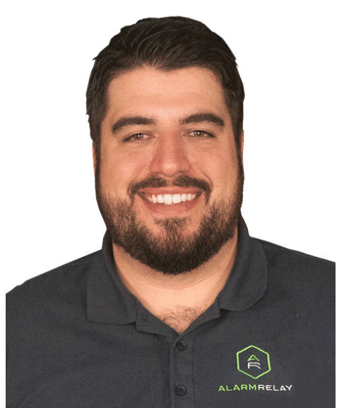 Headshot of a smiling man in a dark polo shirt