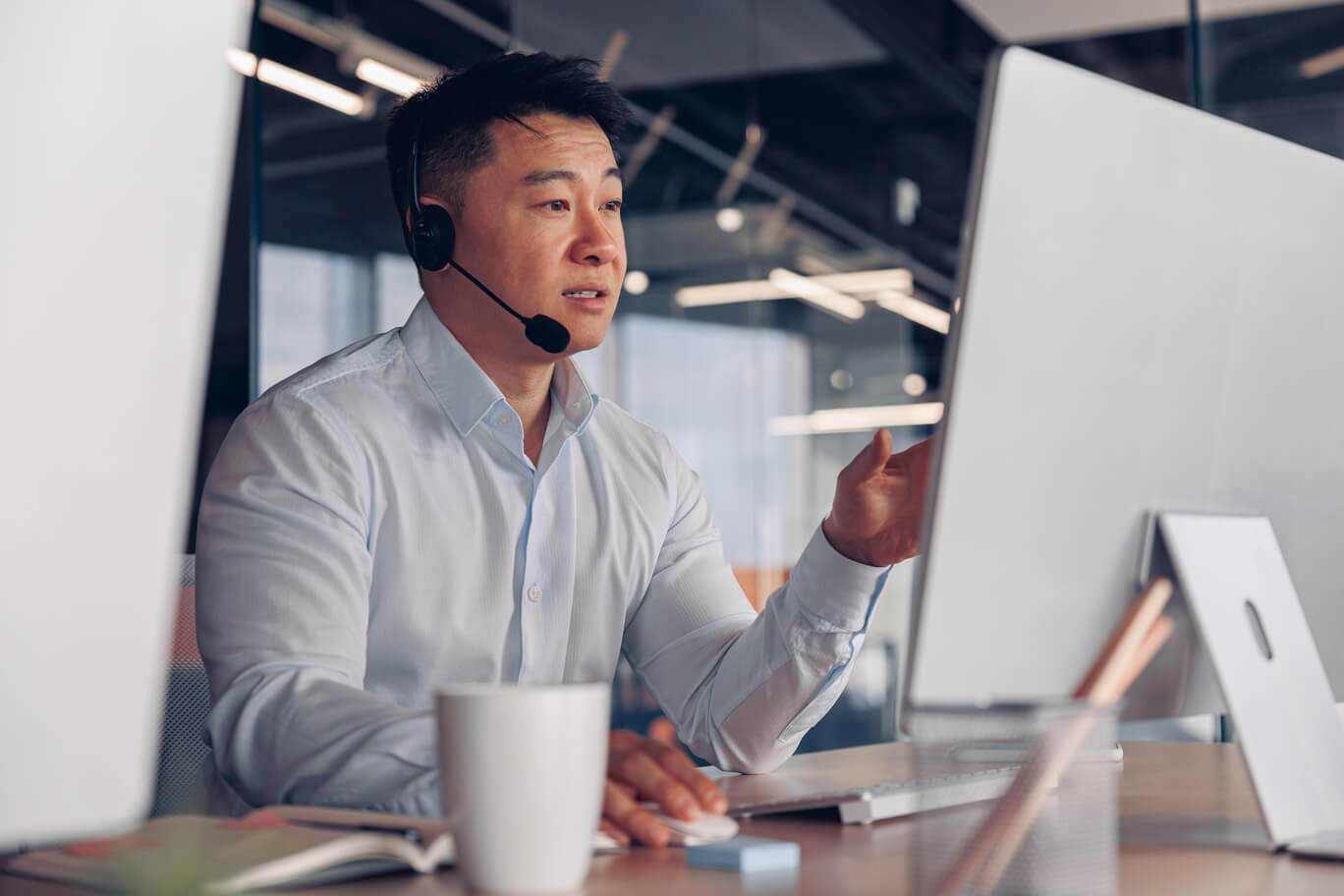 An outsourced marketing specialist providing advice to their client over an online meeting. 