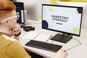 An individual viewing a webinar on how to create a marketing tactical plan.