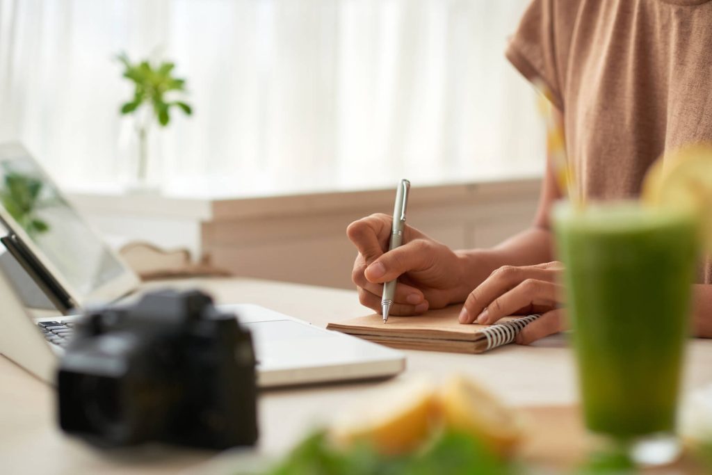 Close-up image of woman making plans after understanding demand generation vs inbound marketing.