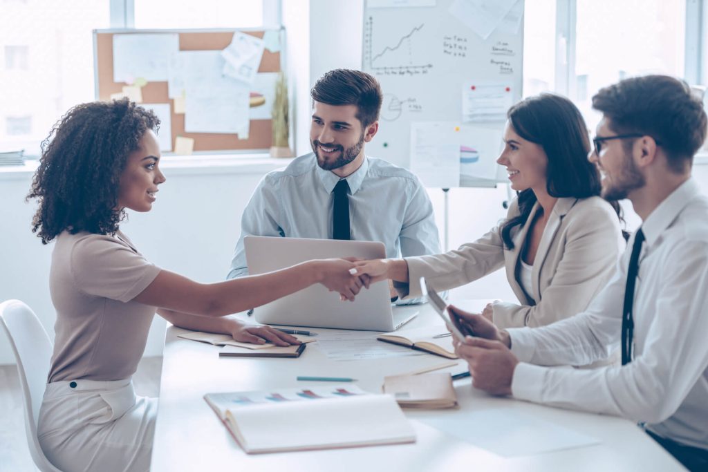 Team members of a startup marketing agency meeting with a new startup CEO.