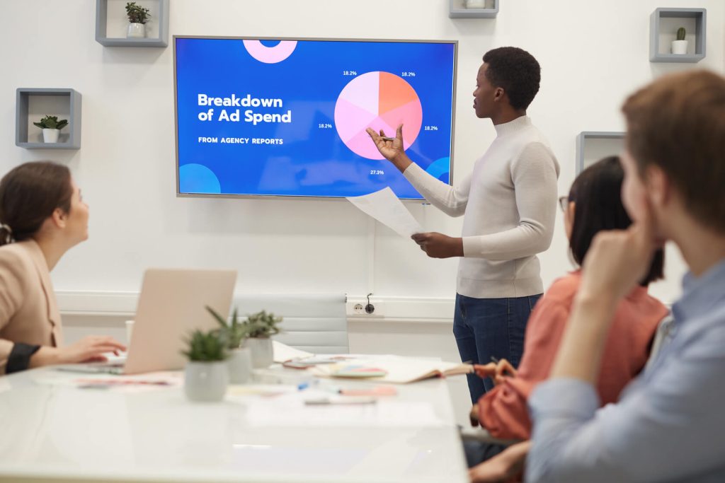 A fractional sales manager makes a presentation.