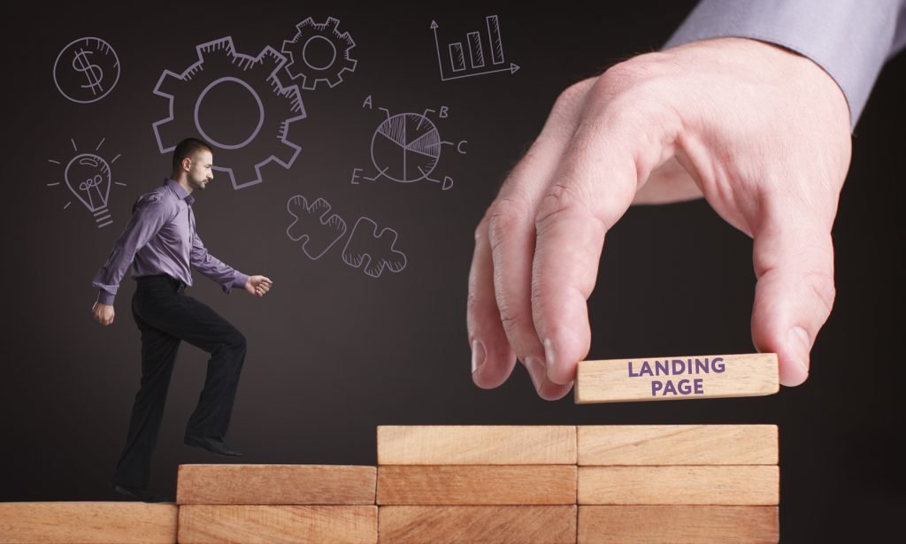 A hand placing a wooden brick labeled "landing page" into a structure, as a man climbs a ladder alongside it, symbolizing the construction of the best landing page for lead generation.