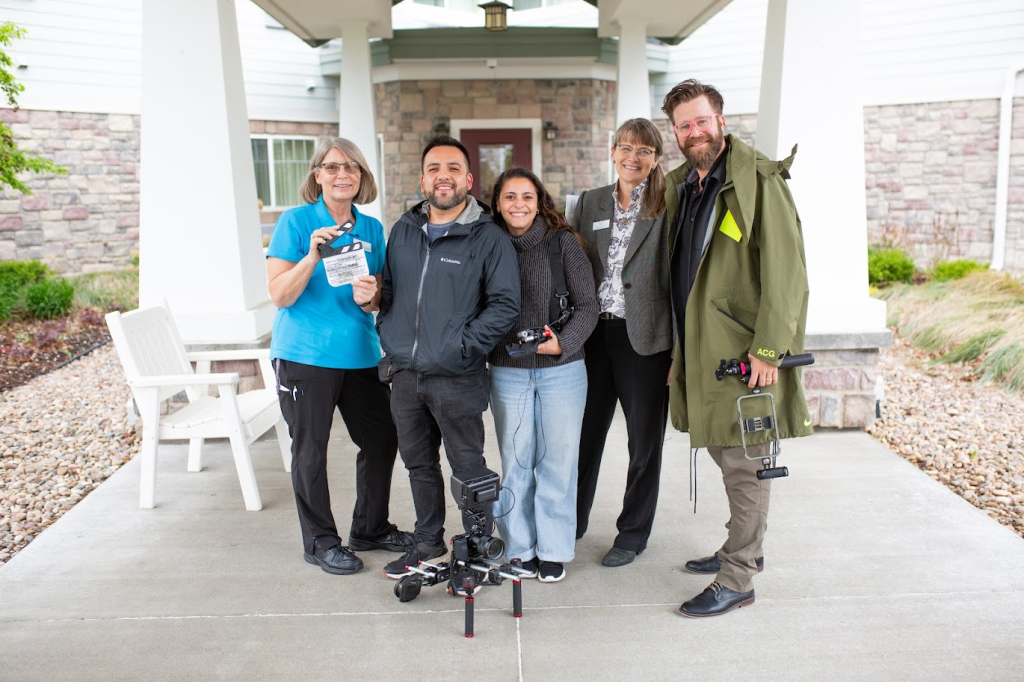 The documentary team with care staff outside a long-term care community