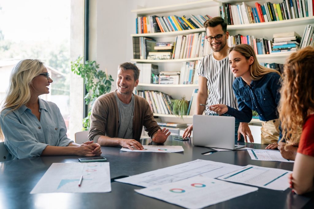 A team discussing why marketing campaigns underperform during a strategy meeting.