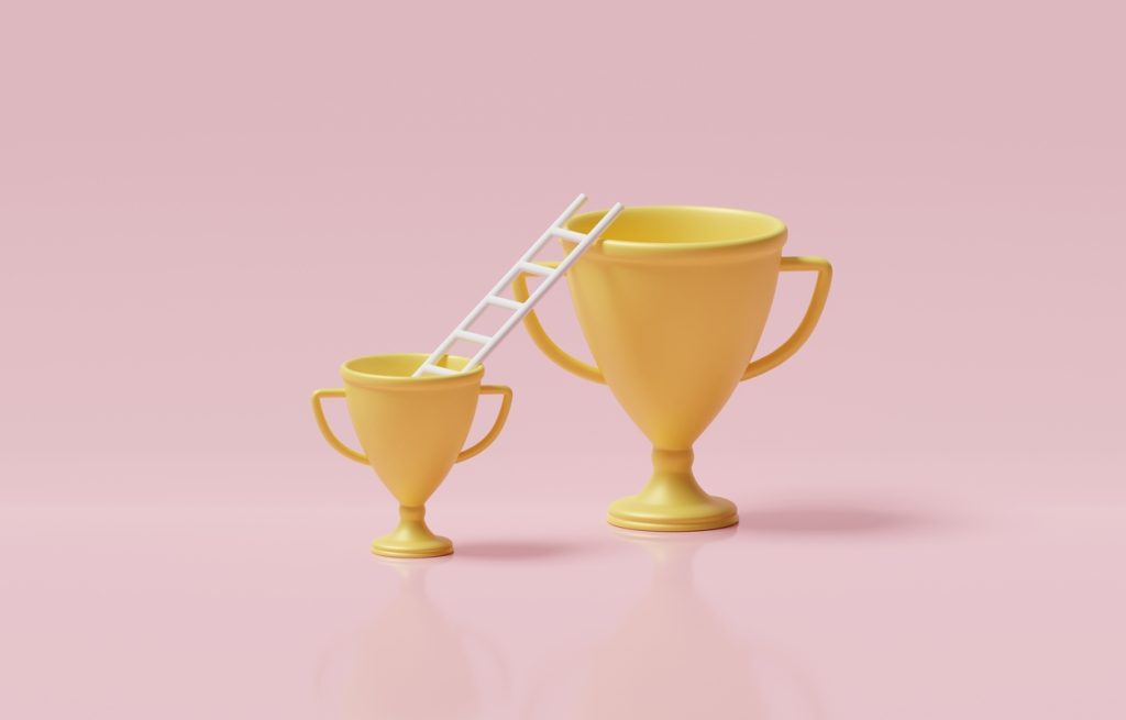 Illustration of two trophies beside a ladder