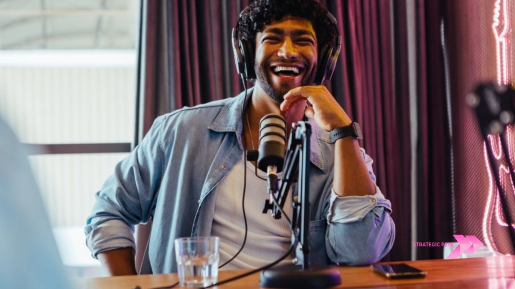 A podcast host speaking into a studio microphone