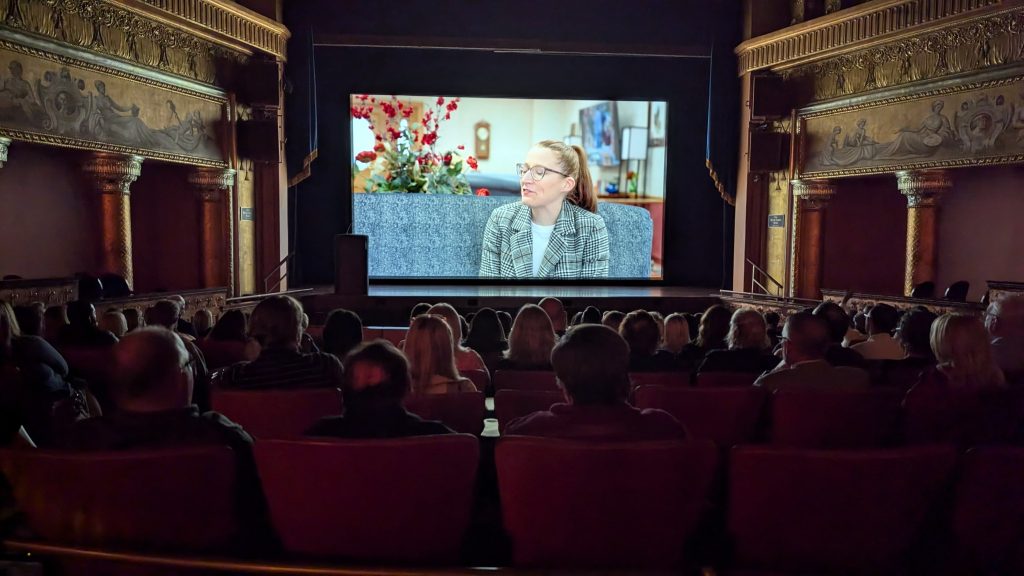 A screening of the People Worth Caring About documentary in a theatre