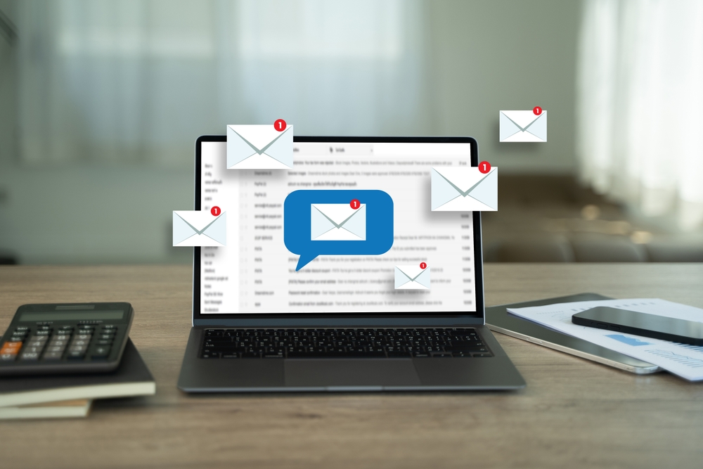 A laptop displaying multiple new email notifications, symbolizing communication and outreach, often used in a developer marketing strategy to engage audiences through email campaigns and targeted messaging.