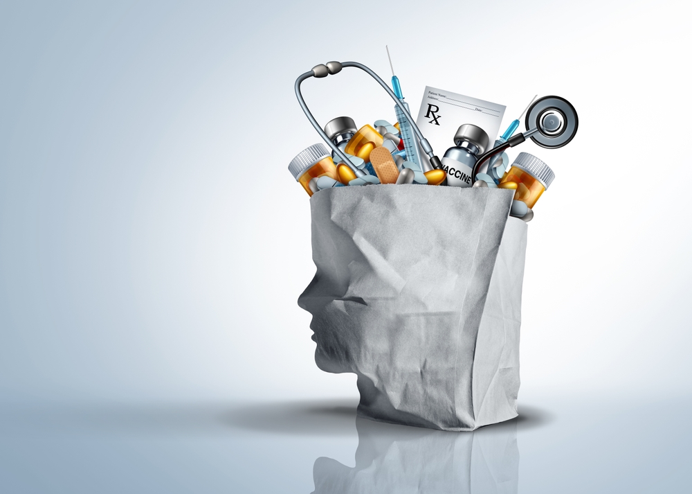 Medical supplies, prescriptions, and diagnostic tools arranged in a head-shaped bag, illustrating a healthcare marketing strategy focused on communicating complex care, services, and patient needs.