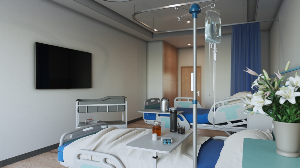 hospital room with patient beds, medical equipment and an IV drip, illustrating healthcare content marketing focused on patient care, clinical services and health education.