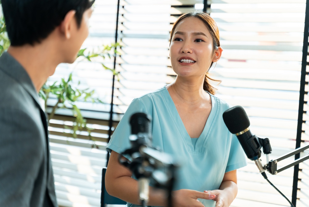 healthcare professional speaking into microphones during an interview, illustrating medical content marketing through expert-led educational media and thought leadership.